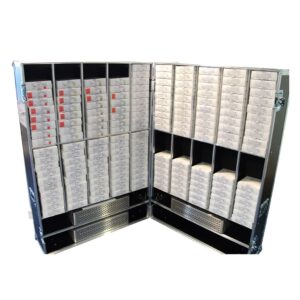 Protective custom flight case for a mobile emergency operating theatre, featuring heavy-duty construction, secure butterfly locks, reinforced ball corners, and custom interior with various dividers and shelves for safe organised transit of critical medical instrumentation