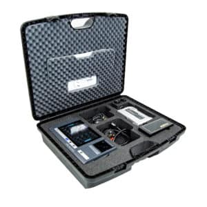 Open protective hard case containing compact electronic testing equipment in foam padding