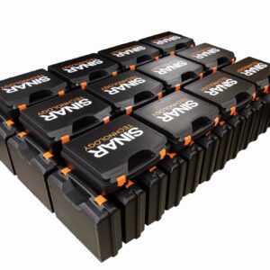 Printed-Plastic-Carrying-Cases - PottertonPacs Row of black printed protective cases with orange latches, stacked in a neat grid, labeled TECHNOLOGY on each case