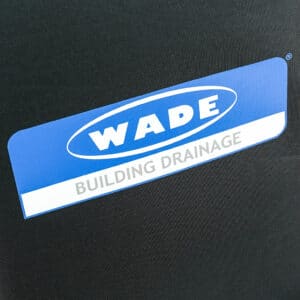 Blue badge with the WADE logo and the words 'BUILDING DRAINAGE' on a dark background.